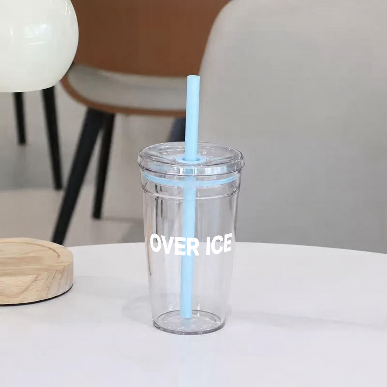 Blue Over Ice cup with a blue straw and lid seal
